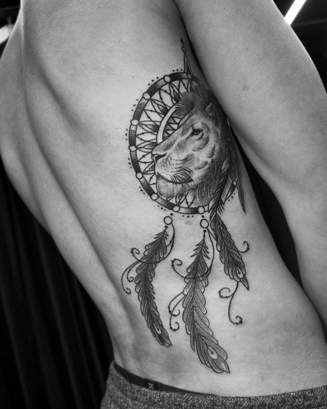 Large black ink side tattoo of dream catcher with lion
