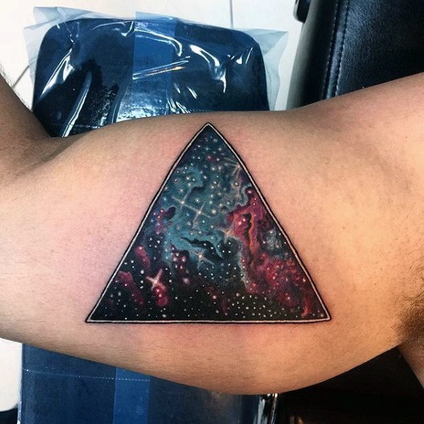 Large colored biceps tattoo of triangle stylized with space