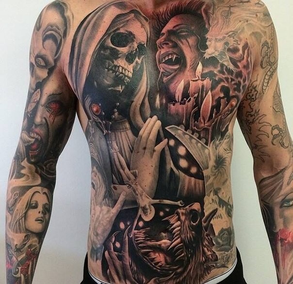 Large colored chest and belly tattoo of various monsters with candles