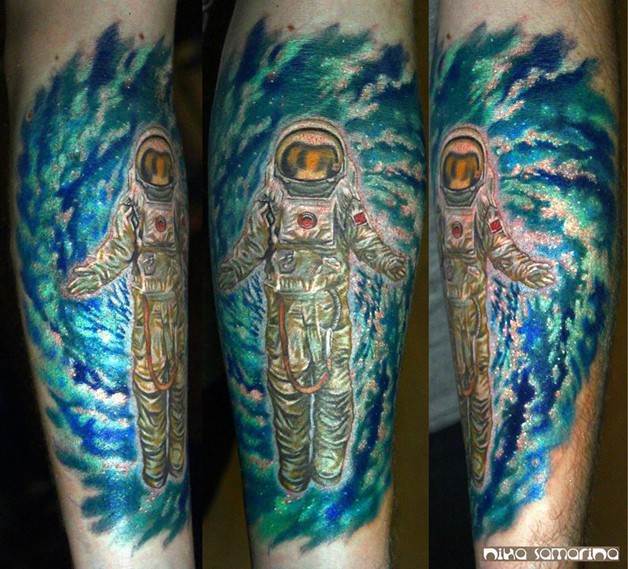 Large colored leg tattoo of illustrative style astronaut