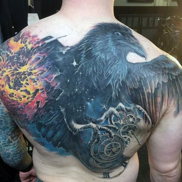 Large colored whole back tattoo of crow with blast and mechanisms