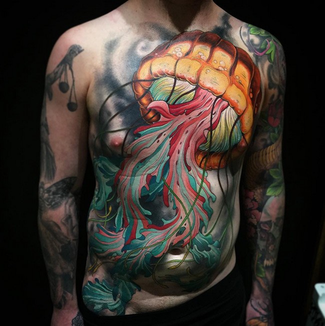 Large cool looking colored chest and belly tattoo of jellyfish