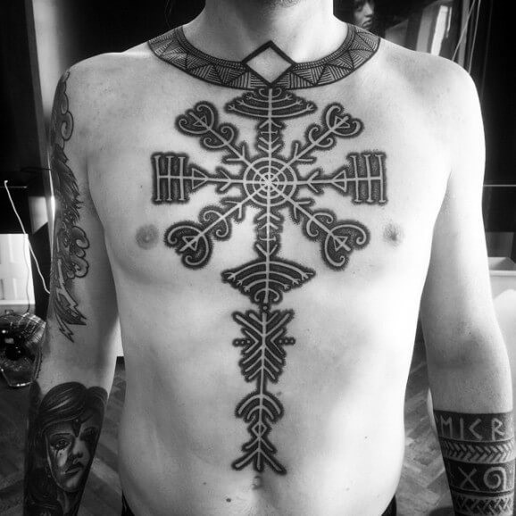 Large detailed black ink chest and belly tattoo of mystical ornament