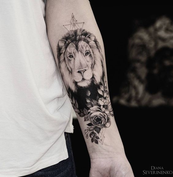 Large dot style forearm tattoo of big lion head with flowers