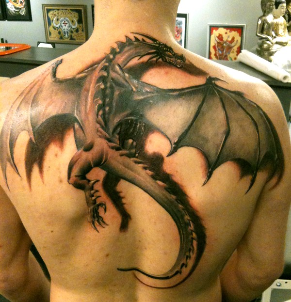 Large fantasy dragon tattoo on back