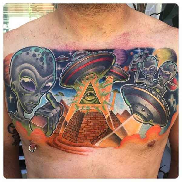 Large illustrative style colored chest tattoo of aliens and pyramids