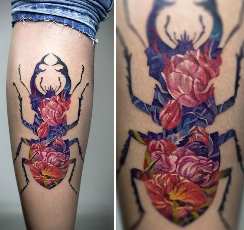 Large illustrative style colored leg tattoo of big bug stylized with flowers