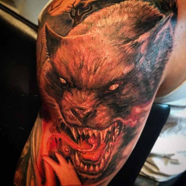 Large illustrative style colored shoulder tattoo of demon werewolf