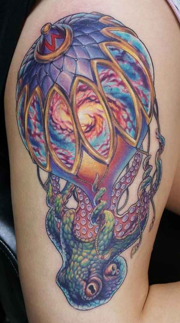 Large illustrative style colored shoulder tattoo of octopus with beautiful balloon