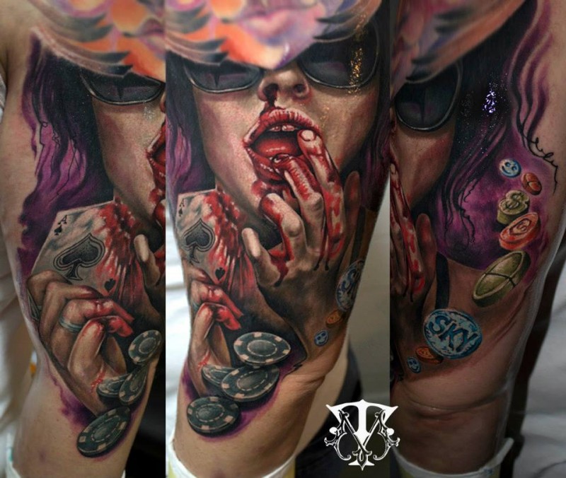 Large illustrative style thigh tattoo of bloody woman with playing card