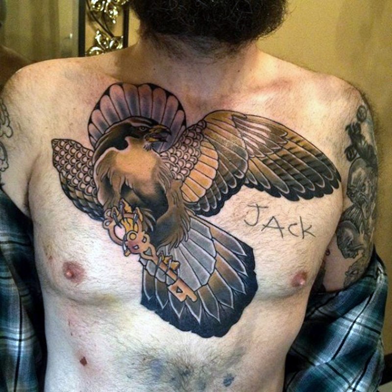 Large modern style colored chest tattoo of flying eagle with antic key and lettering