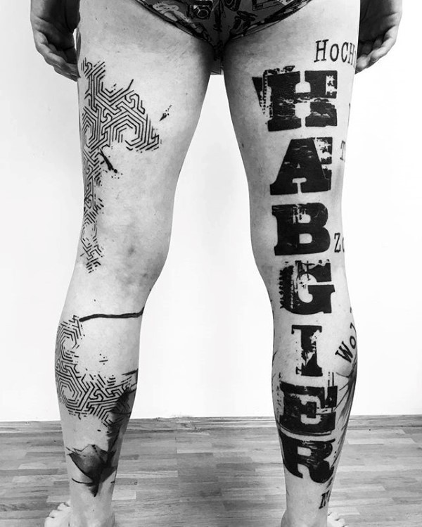 Large modern traditional style black ink lettering tattoo on leg