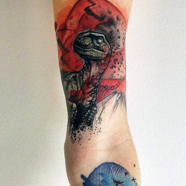Large multicolored  illustrative style arm tattoo of dinosaur