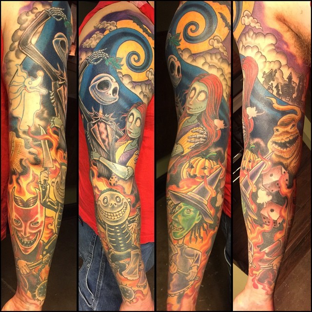 large multicolored sleeve tattoo of various Nightmare before Christmas cartoon heroes