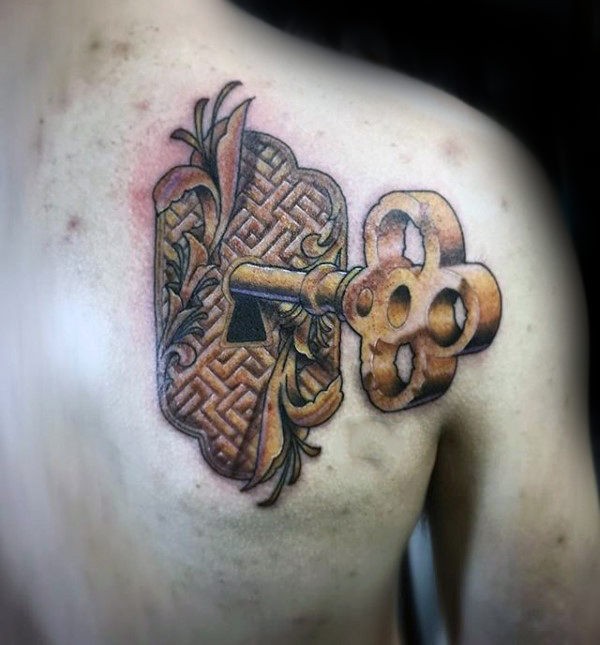 Large new school style scapular tattoo of golden key with keyhole