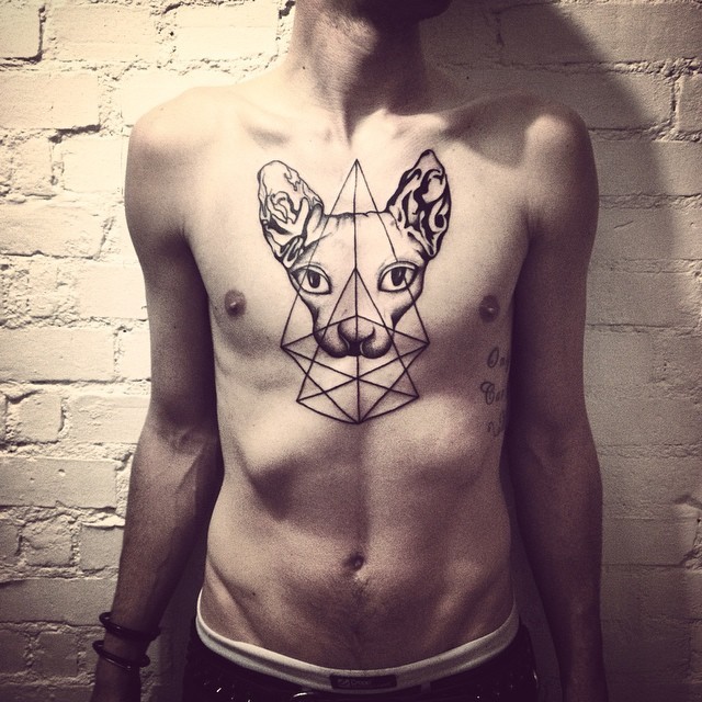 Large nice looking chest tattoo of sphinx cat with geometrical ornaments