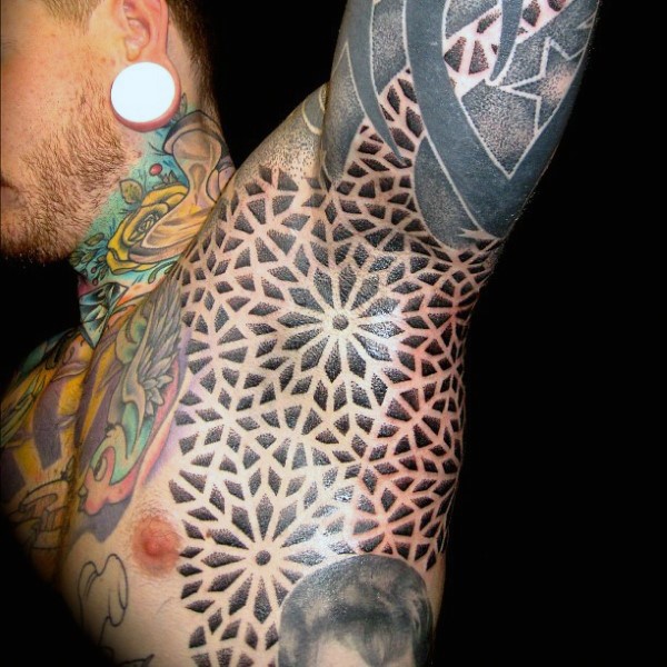 Large ornamental style black ink side and arm tattoo of various flowers