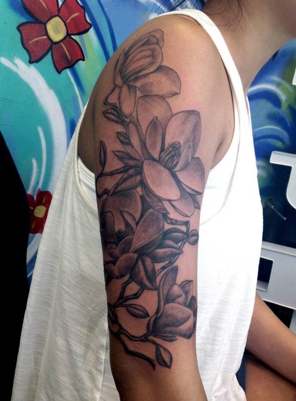Large realistic looking black and white half sleeve tattoo of various flowers