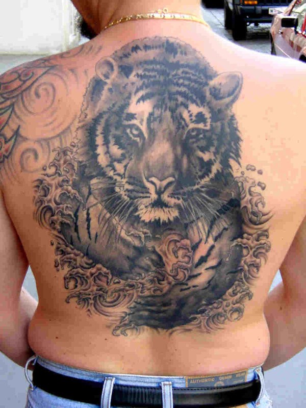 Large black ink tiger tattoo on the back