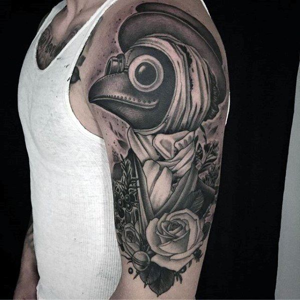 Large upper arm tattoo of woman with plague doctors mask and flowers
