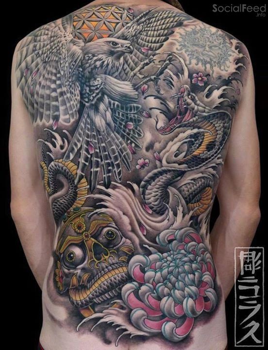 Large very beautiful whole back tattoo of big bird with snake and flower