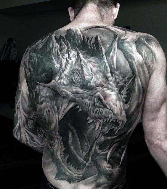 Large very detailed whole back tattoo of large dragon head