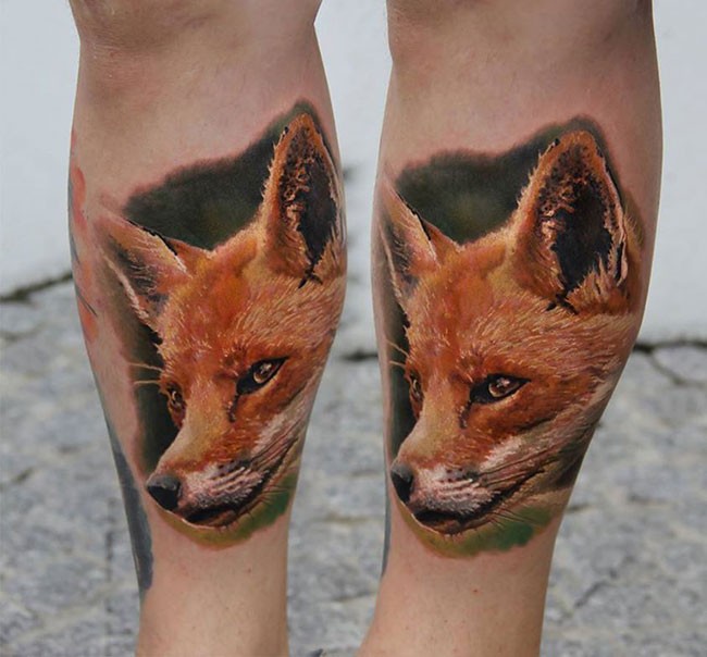 Life like amazing looking colored leg tattoo of sweet fox head