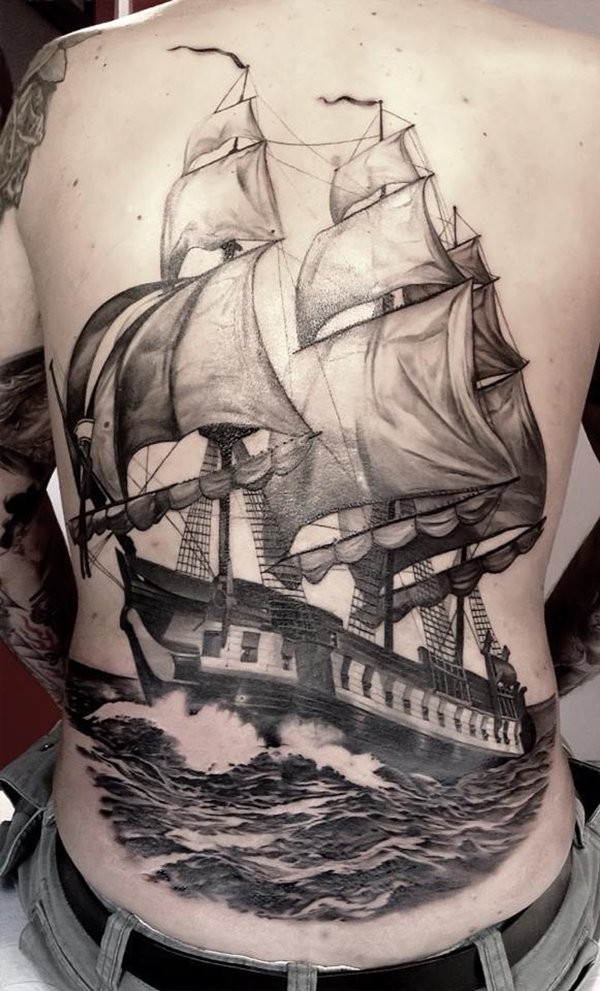 Lifelike black ink whole back tattoo of large sailing ship