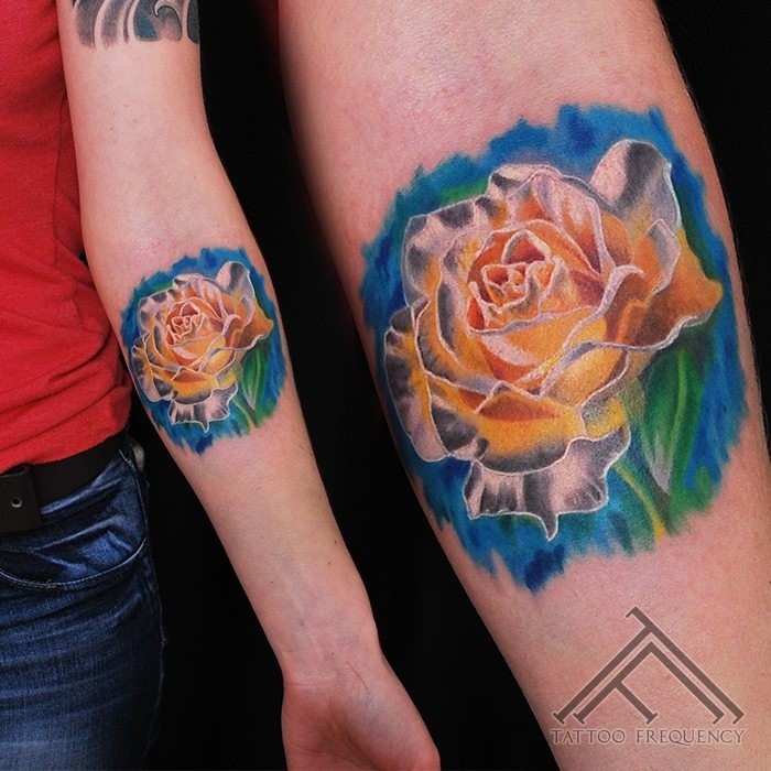 Lifelike colored forearm tattoo of big white rose