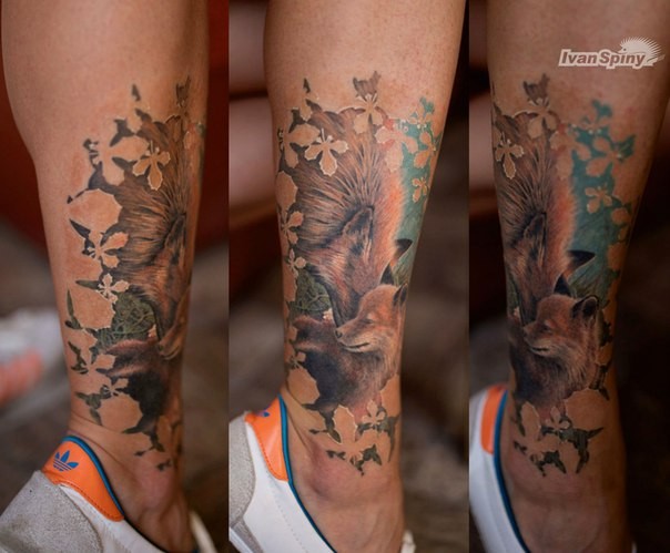 Lifelike sweet looking colored leg tattoo of fox family