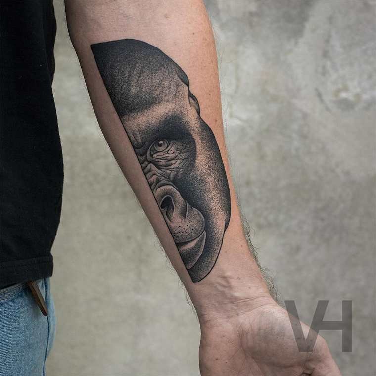 Lifelike very beautiful painted by Valentin Hirsch forearm tattoo of split gorilla head
