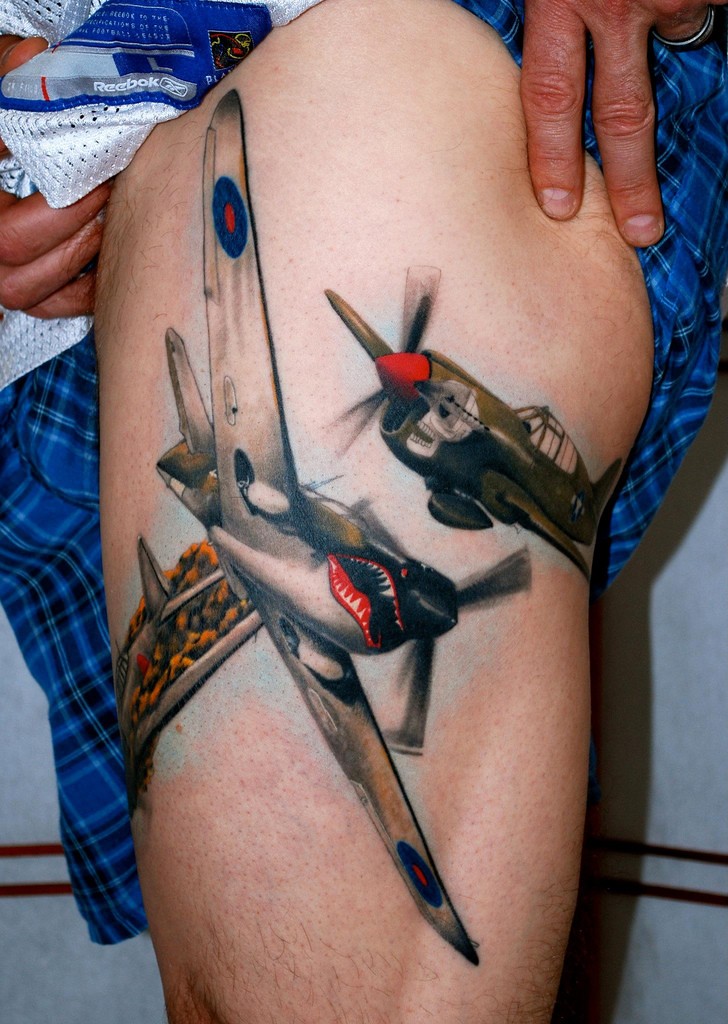 Lifelike very detailed thigh tattoo of WW2 fighter planes