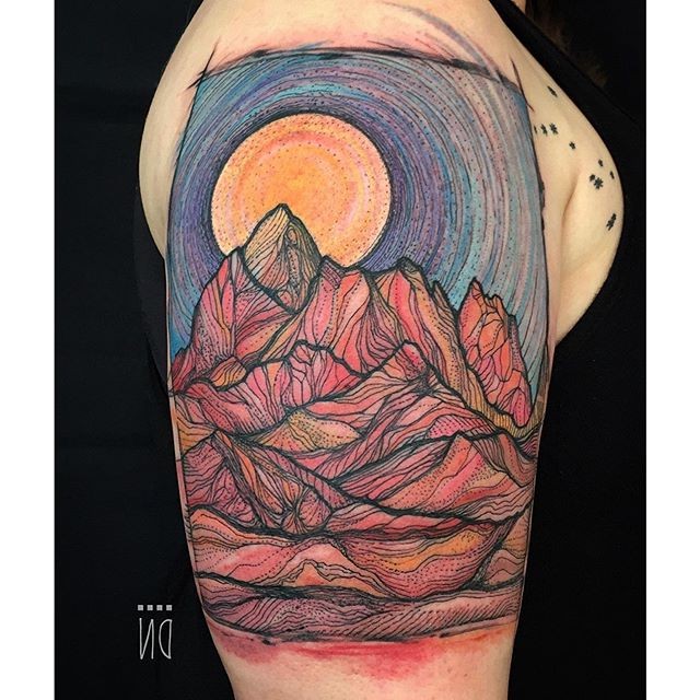 Linework style big colored upper arm tattoo of high mountains