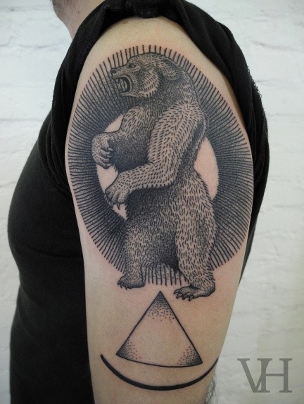 Linework style black ink shoulder tattoo fo big bear and triangle