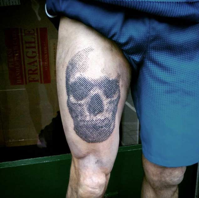 Linework style black ink thigh tattoo of human skull
