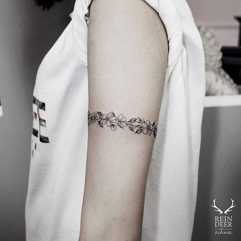 Little arm band shaped painted by Zihwa tattoo of nice flowers