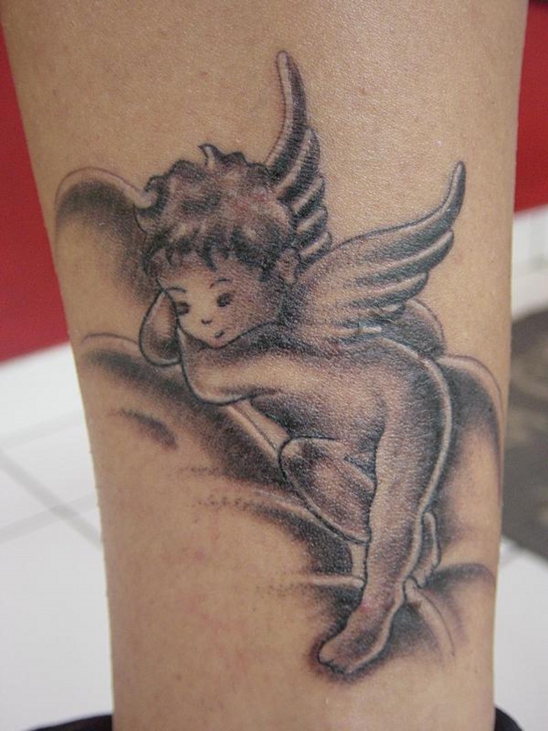 Little baby angel tattoo on leg