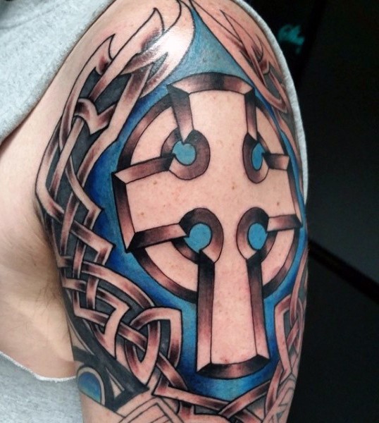Little beautiful colored Celtic cross tattoo on shoulder - Tattooimages.biz
