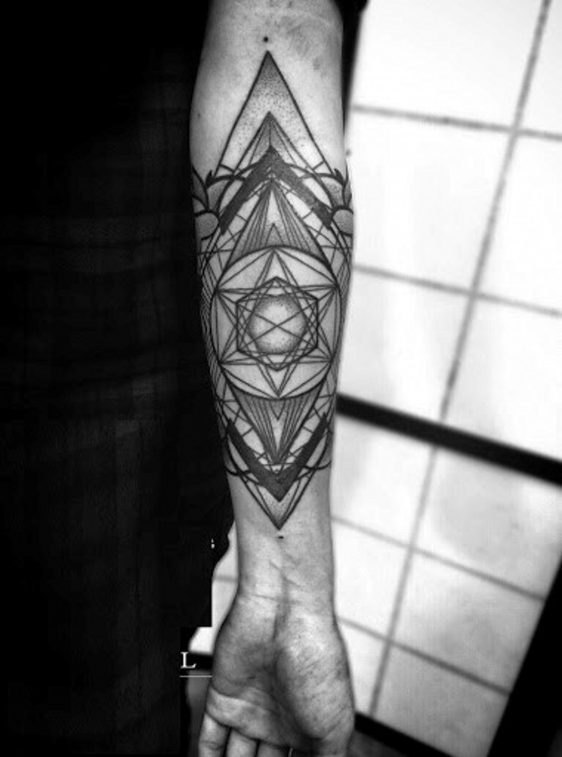 Little black and white geometrical tattoo on arm