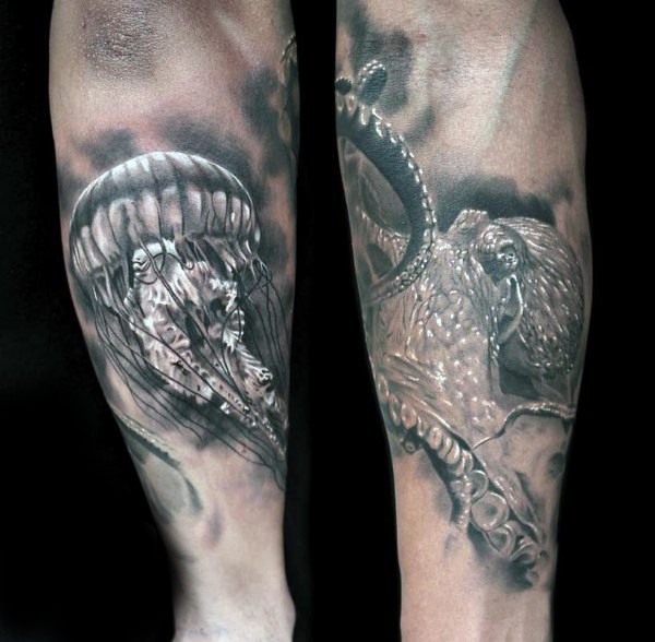 Little black and white jellyfish and octopus tattoo on arm