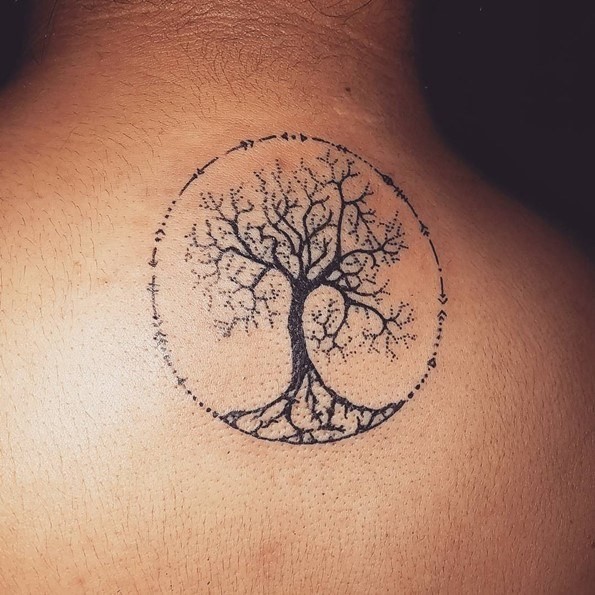 Little black and white simple mystical upper back tattoo of tree in circle