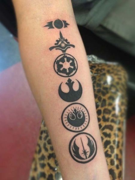 Little black ink cool forearm tattoo of various Star Wars emblems
