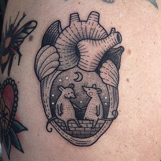 Little black ink heart shaped tattoo stylized with mouse couple