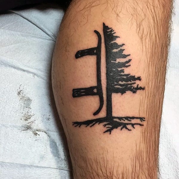 Little black ink leg tattoo of tree with snowboard