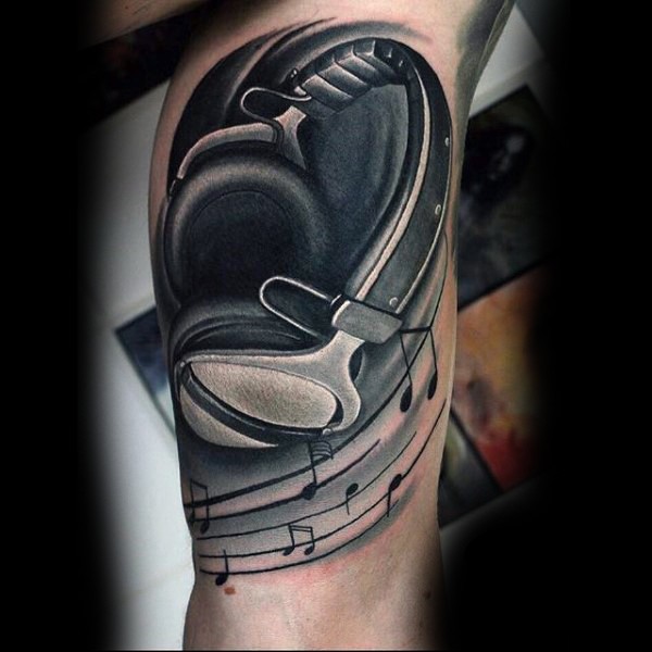 Little black ink music headset tattoo on leg