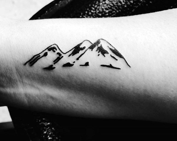 Little black ink simple painted mountains tattoo on arm