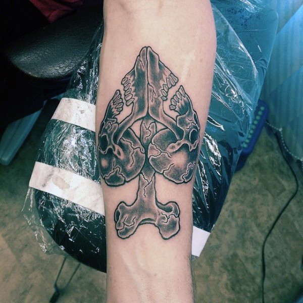 Little black ink spades symbol designed from bones tattoo on arm