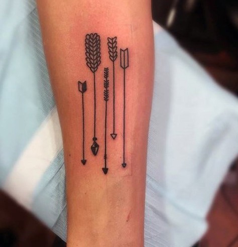Little black ink various arrows tattoo on arm