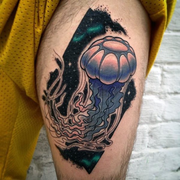 Little cartoon like colored jelly-fish in space tattoo on thigh