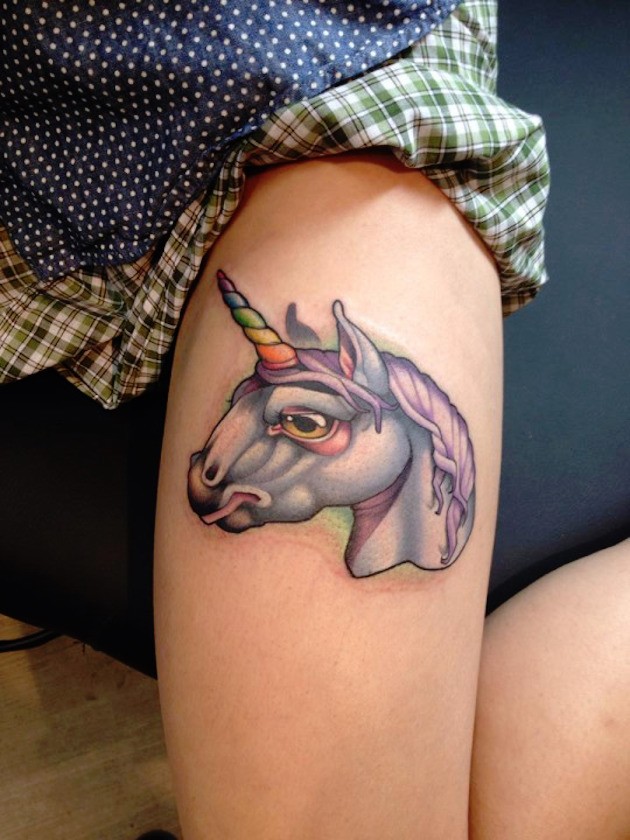 Little cartoon like fantasy unicorn tattoo on leg